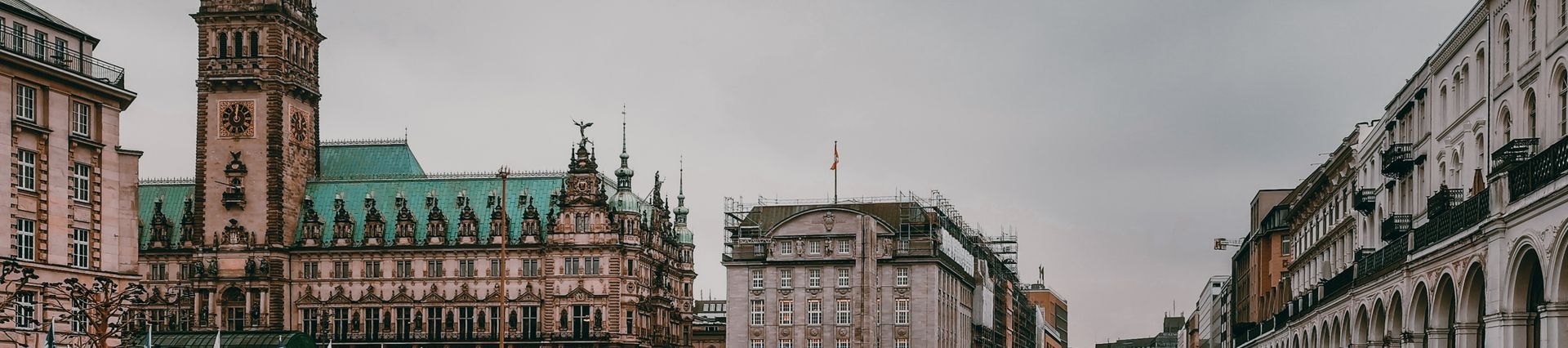 Historic canal and city hall in Hamburg; illustrative city photograph